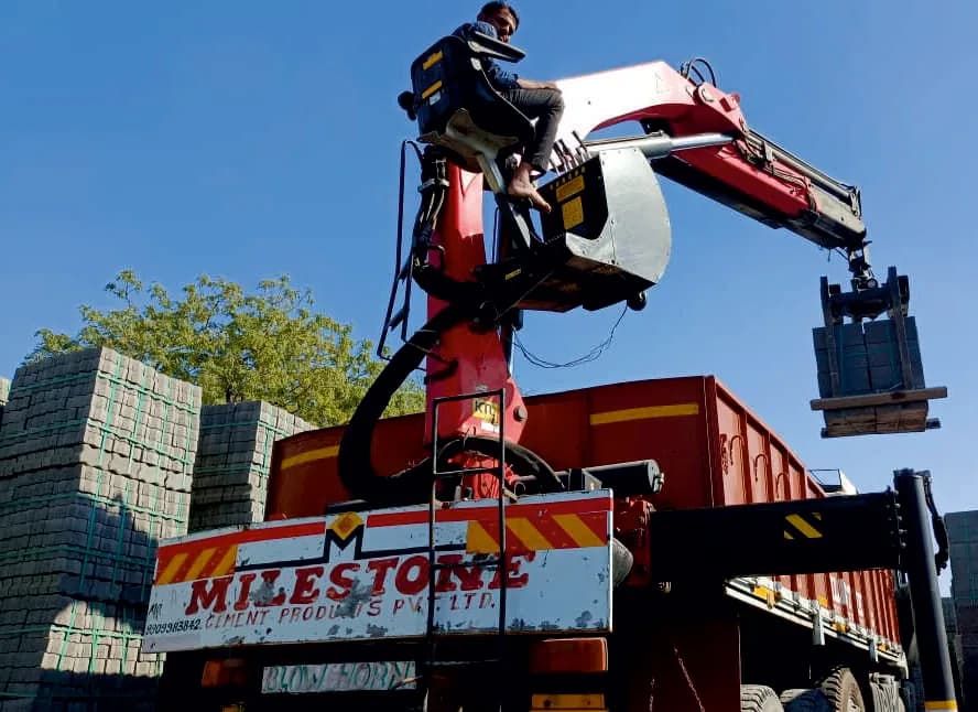 Front loader at Milestone's batching plant under the factory shed