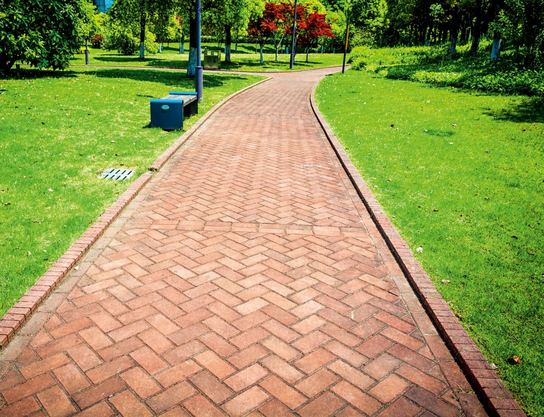 Milestone paver block pathway in a landscaped setting